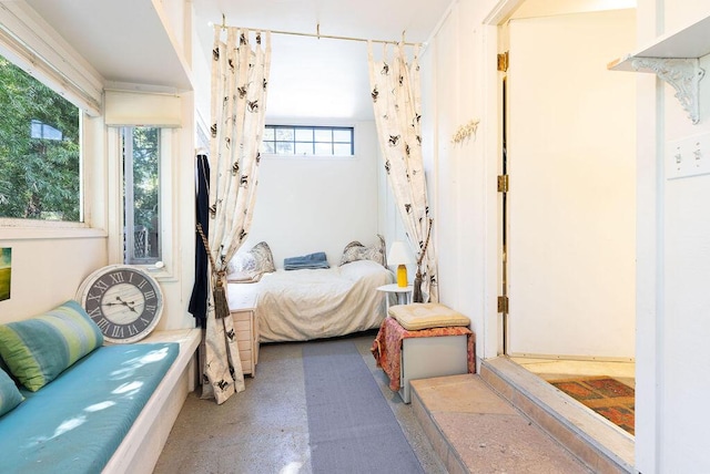 bedroom with concrete flooring