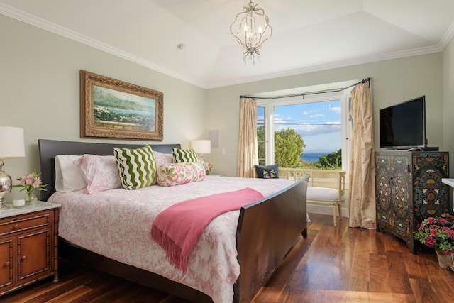 bedroom featuring dark wood-style floors, lofted ceiling, crown molding, a notable chandelier, and a raised ceiling