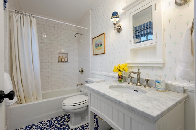 full bath featuring toilet, wallpapered walls, wainscoting, shower / bath combination with curtain, and vanity