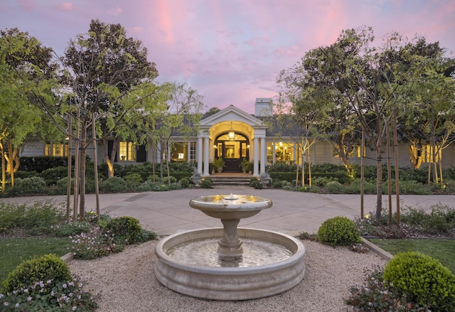 greek revival house with curved driveway