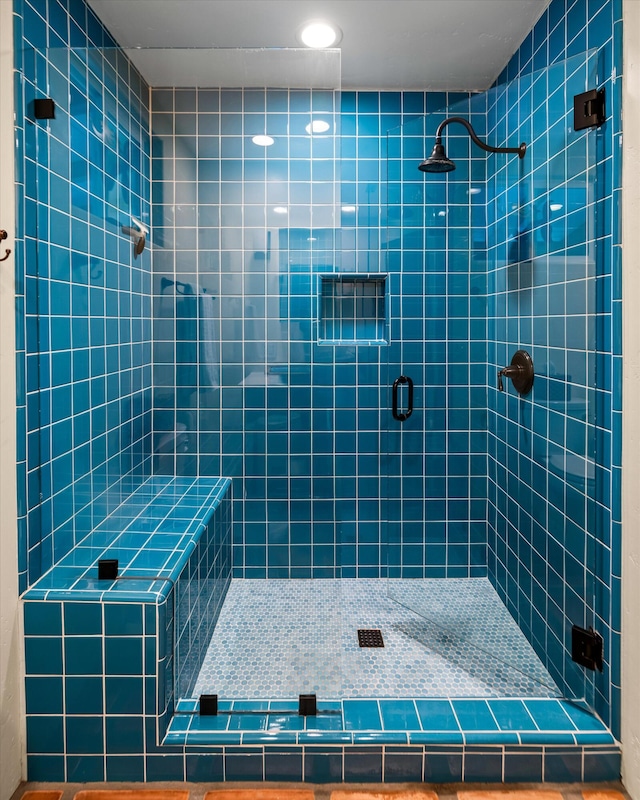 full bath with a shower stall