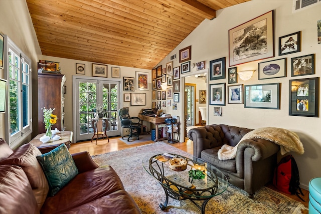 living room featuring lofted ceiling with beams, wood ceiling, and visible vents