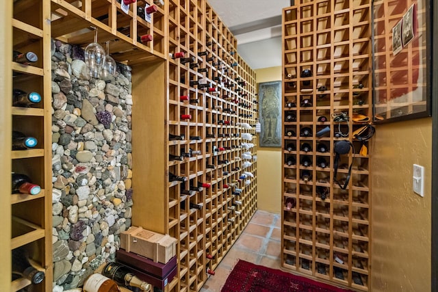 wine area featuring tile patterned flooring