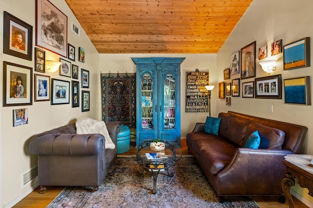 living room with wood ceiling, wood finished floors, and vaulted ceiling