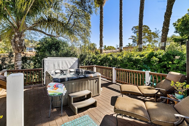 wooden deck featuring a hot tub