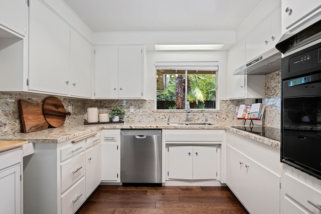 kitchen featuring black appliances, a sink, tasteful backsplash, dark wood-style floors, and white cabinets