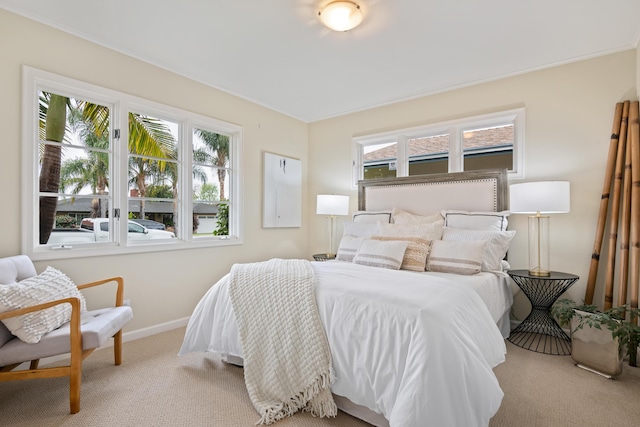 carpeted bedroom with baseboards