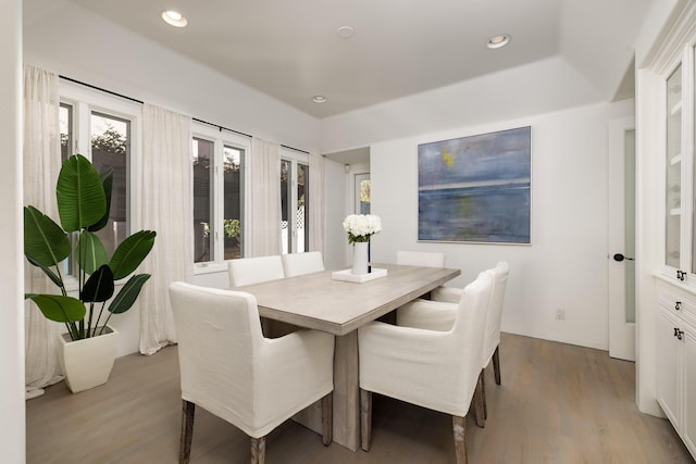 dining space with recessed lighting and wood finished floors