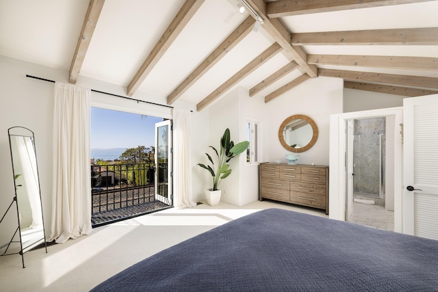 bedroom with lofted ceiling with beams, access to outside, and connected bathroom