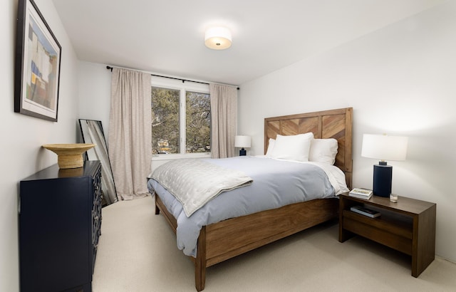 bedroom with light colored carpet