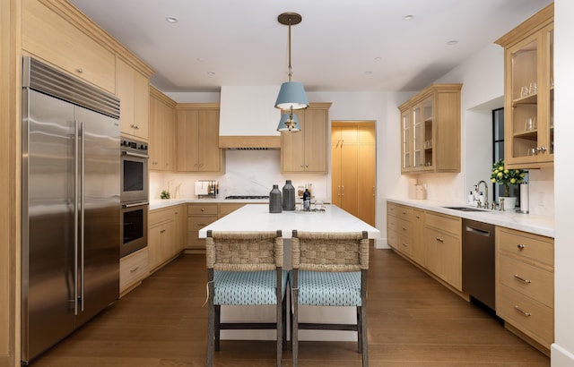 kitchen featuring appliances with stainless steel finishes and light brown cabinets