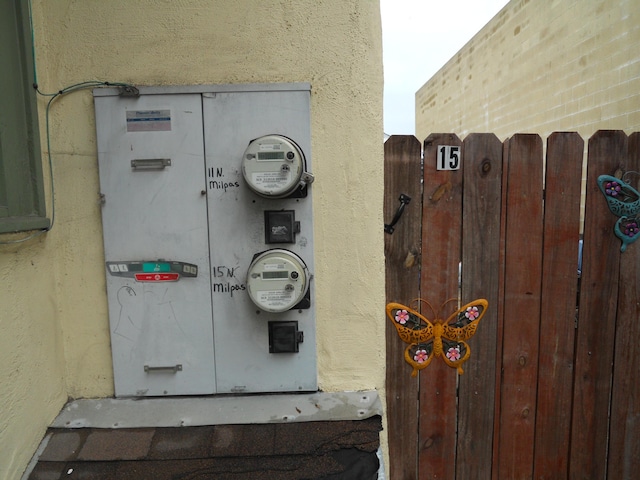 exterior details featuring stucco siding and electric meter