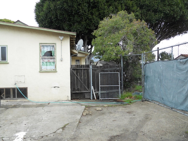 view of gate with fence