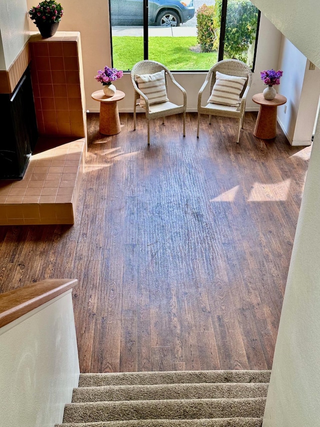 interior space featuring stairs, plenty of natural light, and wood finished floors