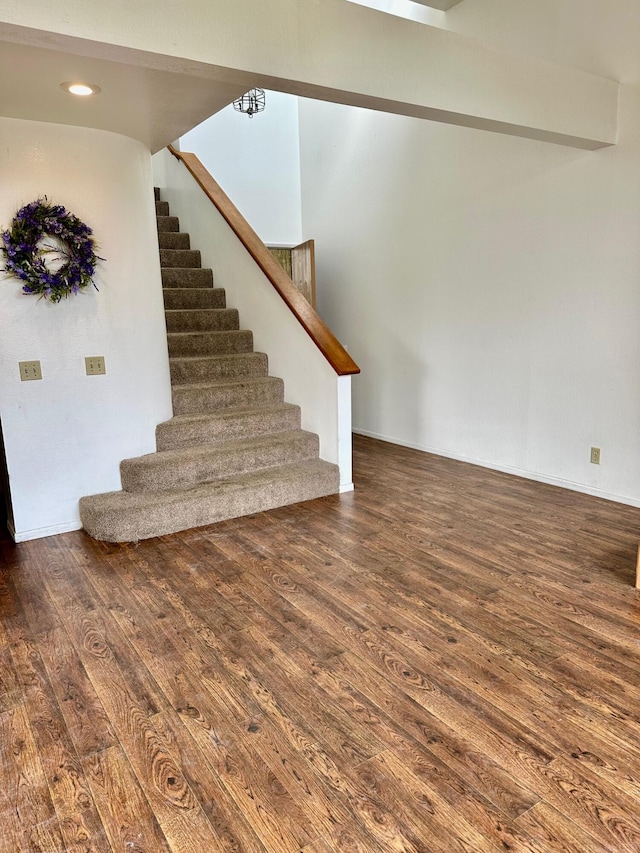 stairs with wood finished floors