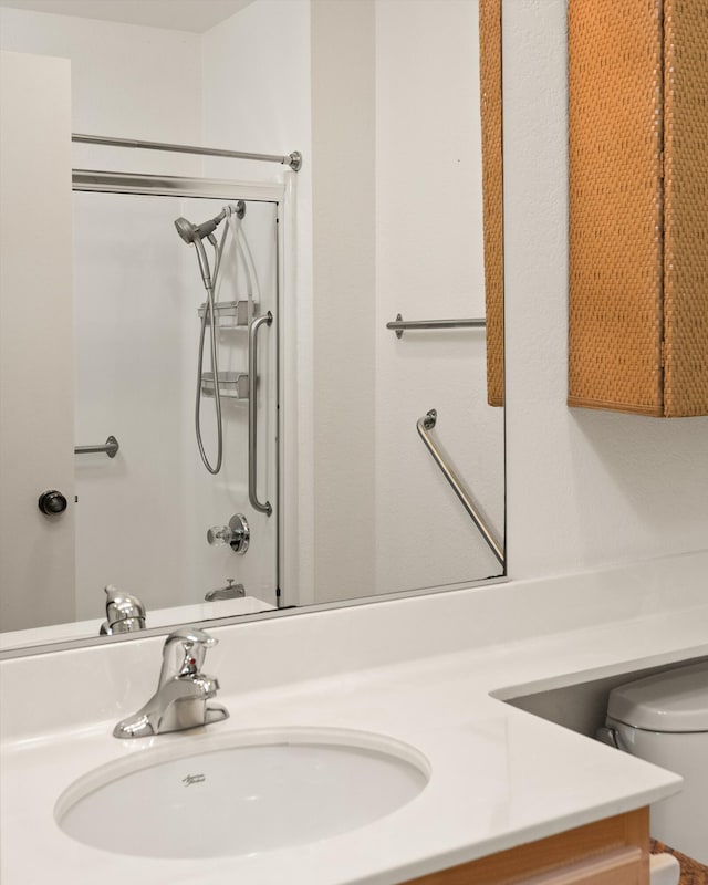 bathroom featuring toilet and vanity