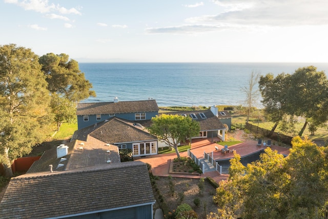 birds eye view of property with a water view