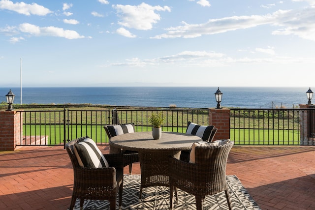 view of patio / terrace featuring outdoor dining area and a water view