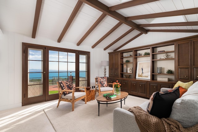 living room with a water view, light colored carpet, and vaulted ceiling with beams