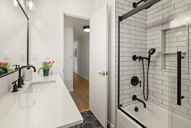 bathroom featuring baseboards, bathing tub / shower combination, vanity, and tile patterned flooring