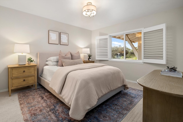 bedroom with carpet and baseboards