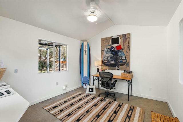 home office featuring baseboards, finished concrete flooring, a ceiling fan, and vaulted ceiling