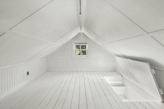 bonus room with vaulted ceiling with beams, wood finished floors, and a sauna