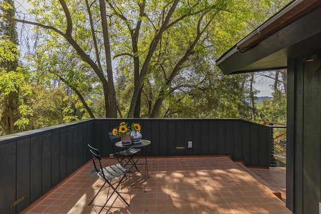 view of patio with a balcony