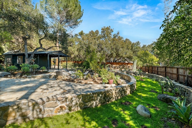 view of yard with a patio and fence