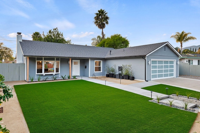 ranch-style house featuring fence, concrete driveway, a front yard, a chimney, and a garage