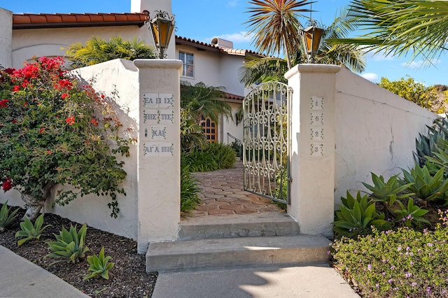 view of gate with fence