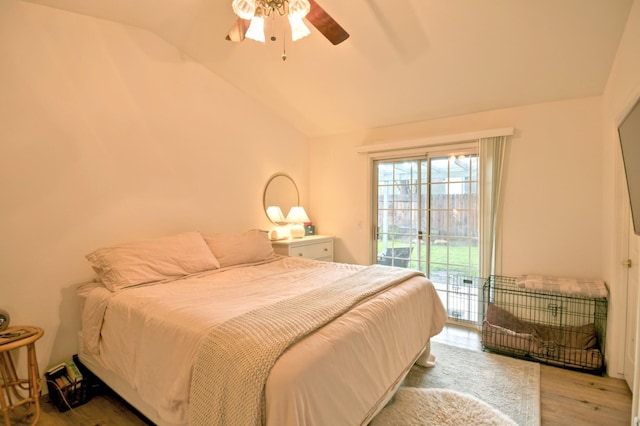 bedroom with wood finished floors, a ceiling fan, lofted ceiling, and access to outside