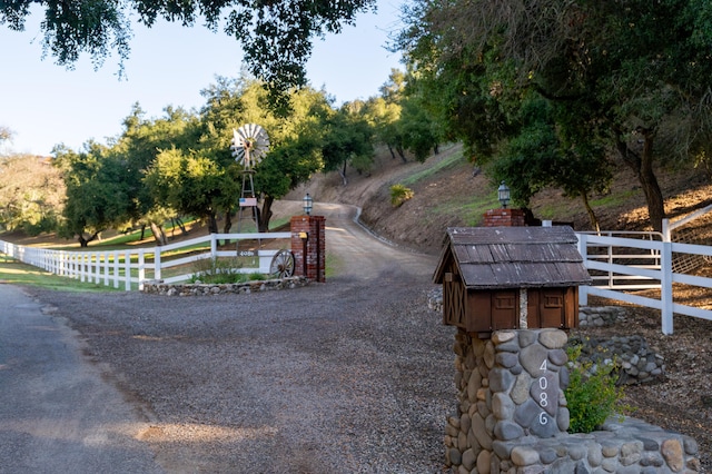 view of community featuring fence