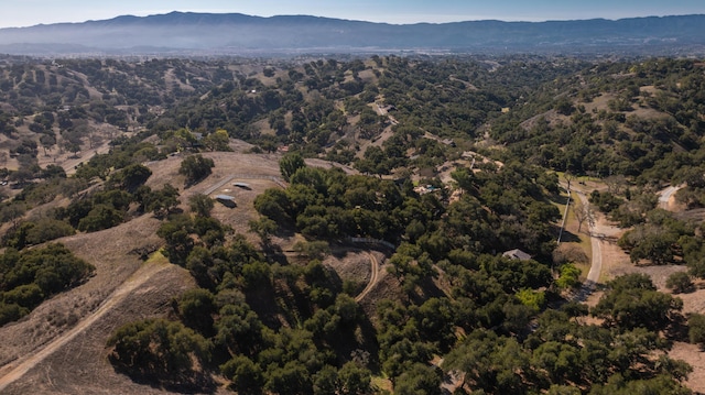 aerial view with a mountain view and a forest view