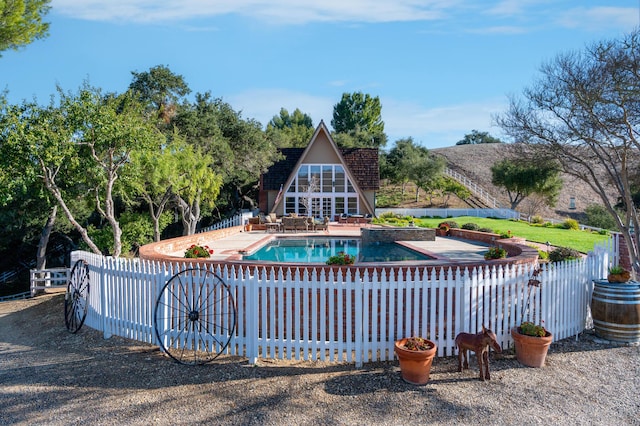 view of pool with a patio area, fence, and a fenced in pool