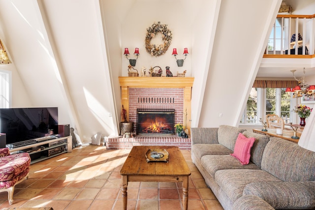 living area featuring tile patterned floors, a fireplace, and a towering ceiling