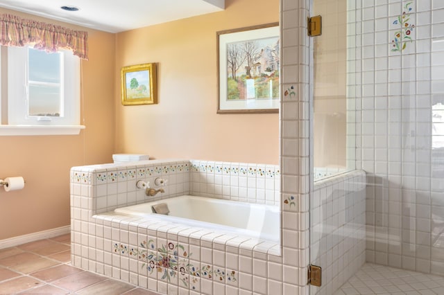 bathroom with a garden tub, tile patterned floors, and a shower stall