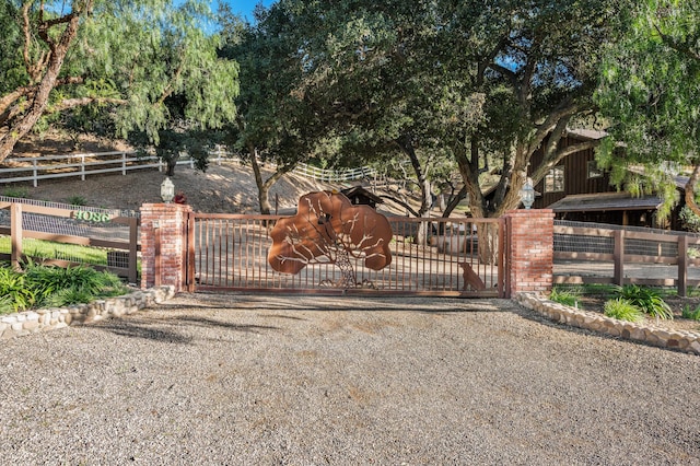 view of gate with fence