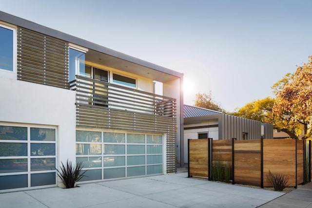 903 W Mission St, Santa Barbara, CA 93101 - modern home featuring fence, driveway, stucco siding, and a garage