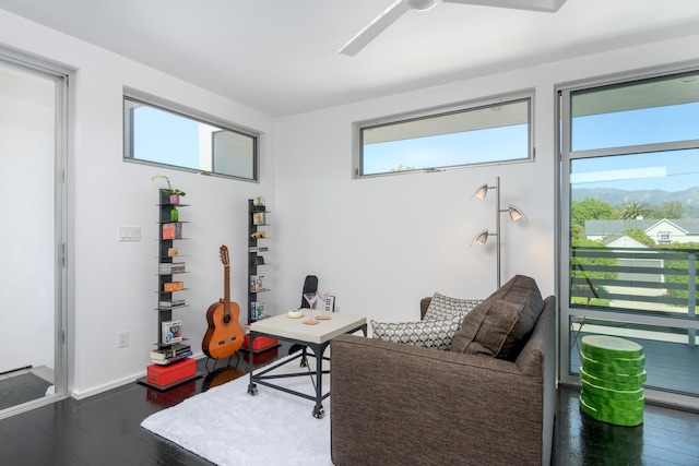 903 W Mission St, Santa Barbara, CA 93101 - living room with a ceiling fan, dark wood-style flooring, and baseboards