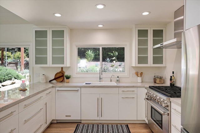 5134 Cathedral Oaks Rd, Santa Barbara, CA 93111 - kitchen featuring a wealth of natural light, white cabinets, appliances with stainless steel finishes, and a sink