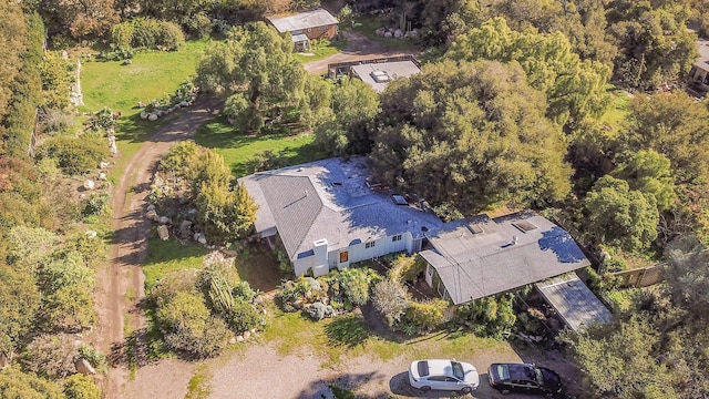birds eye view of property with a wooded view