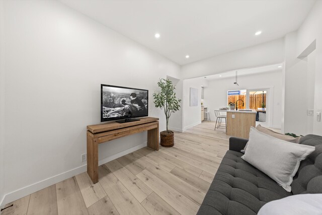 334 W Mission St, Santa Barbara, CA 93101 - living room featuring recessed lighting, light wood-type flooring, and baseboards