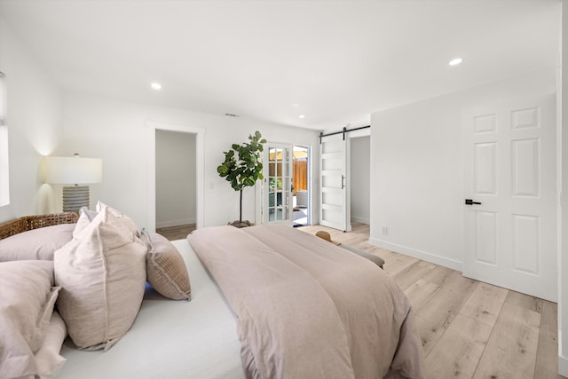 334 W Mission St, Santa Barbara, CA 93101 - bedroom featuring light wood-type flooring, recessed lighting, baseboards, and a barn door