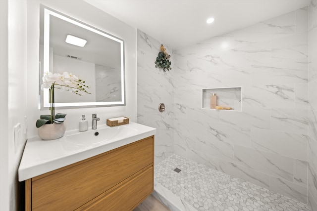 334 W Mission St, Santa Barbara, CA 93101 - bathroom with vanity, a marble finish shower, and recessed lighting
