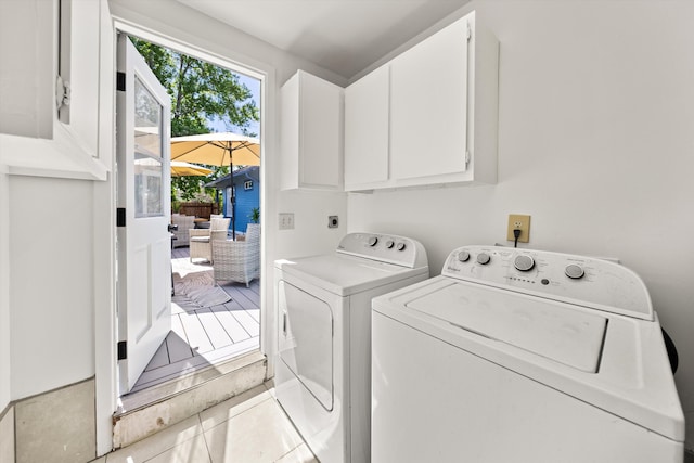 334 W Mission St, Santa Barbara, CA 93101 - laundry room featuring separate washer and dryer, cabinet space, and light tile patterned floors