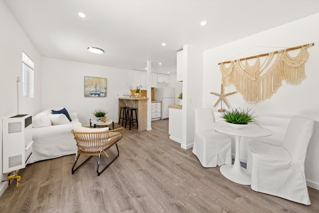 334 W Mission St, Santa Barbara, CA 93101 - living room with light wood-type flooring, heating unit, and recessed lighting