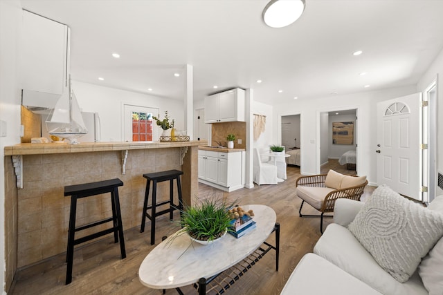 334 W Mission St, Santa Barbara, CA 93101 - living area with wood finished floors, recessed lighting, and baseboards