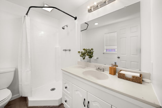 334 W Mission St, Santa Barbara, CA 93101 - full bathroom with toilet, vanity, curtained shower, and wood finished floors