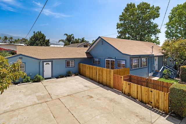 334 W Mission St, Santa Barbara, CA 93101 - view of front of house featuring a fenced front yard and a shingled roof